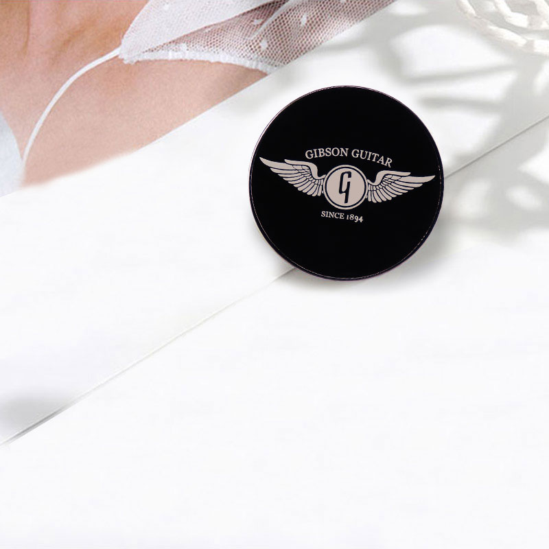 Gibson Guitar Wing Enamel Pin  - огляд і ціна Musical Instrument Logo